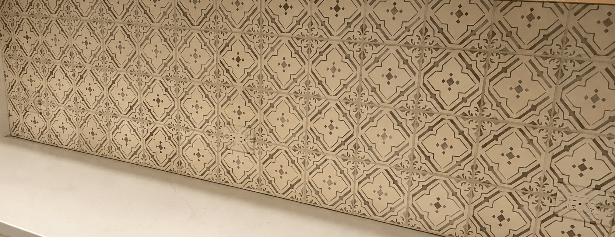 Third designer outlet integrated into a specialty wall finish