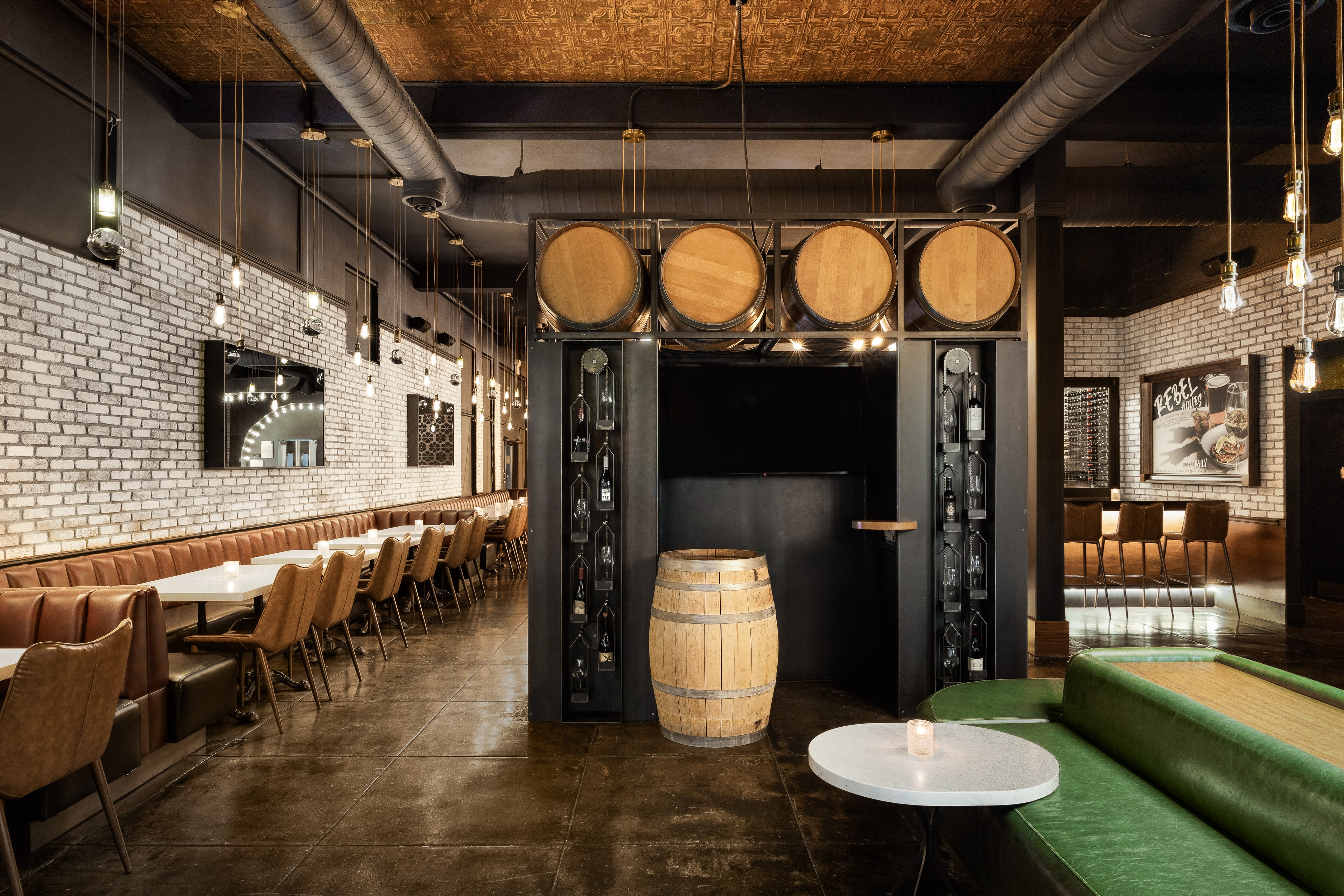 Copper tin ceiling, brick whitewash, and midnight sky ceiling at BlackSheep Wine Bar